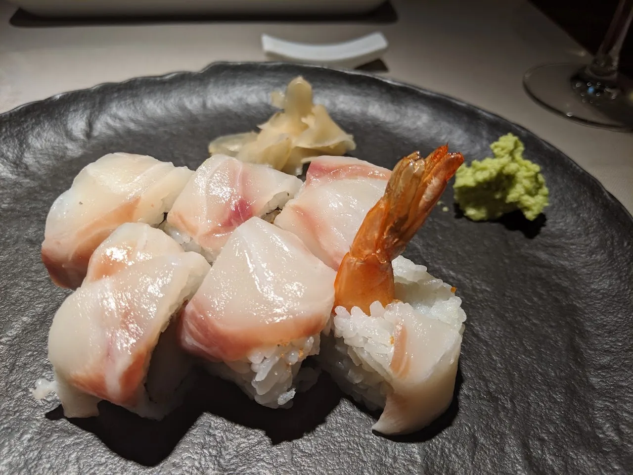 An assortment of nigiri sushi with shrimp and white fish
