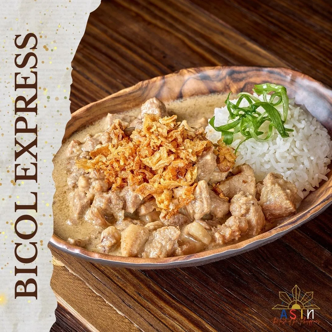 Bicol Express pork simmered in a creamy spicy sauce with rice