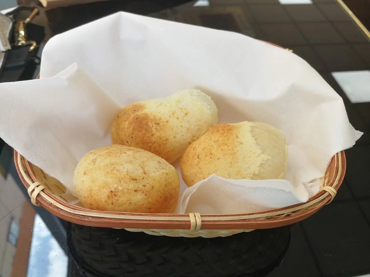 A basket of fresh bread rolls