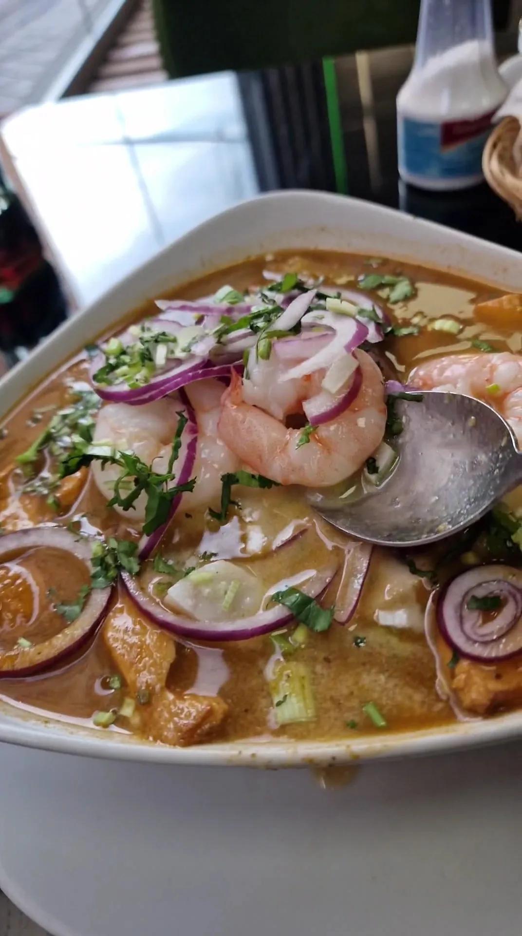 A seafood ceviche soup with shrimp and octopus