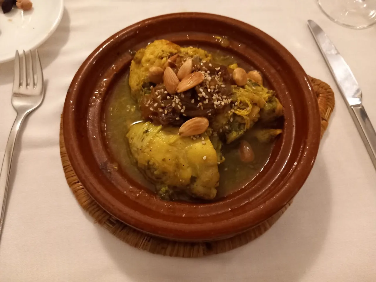 Chicken tagine with almonds in a clay pot