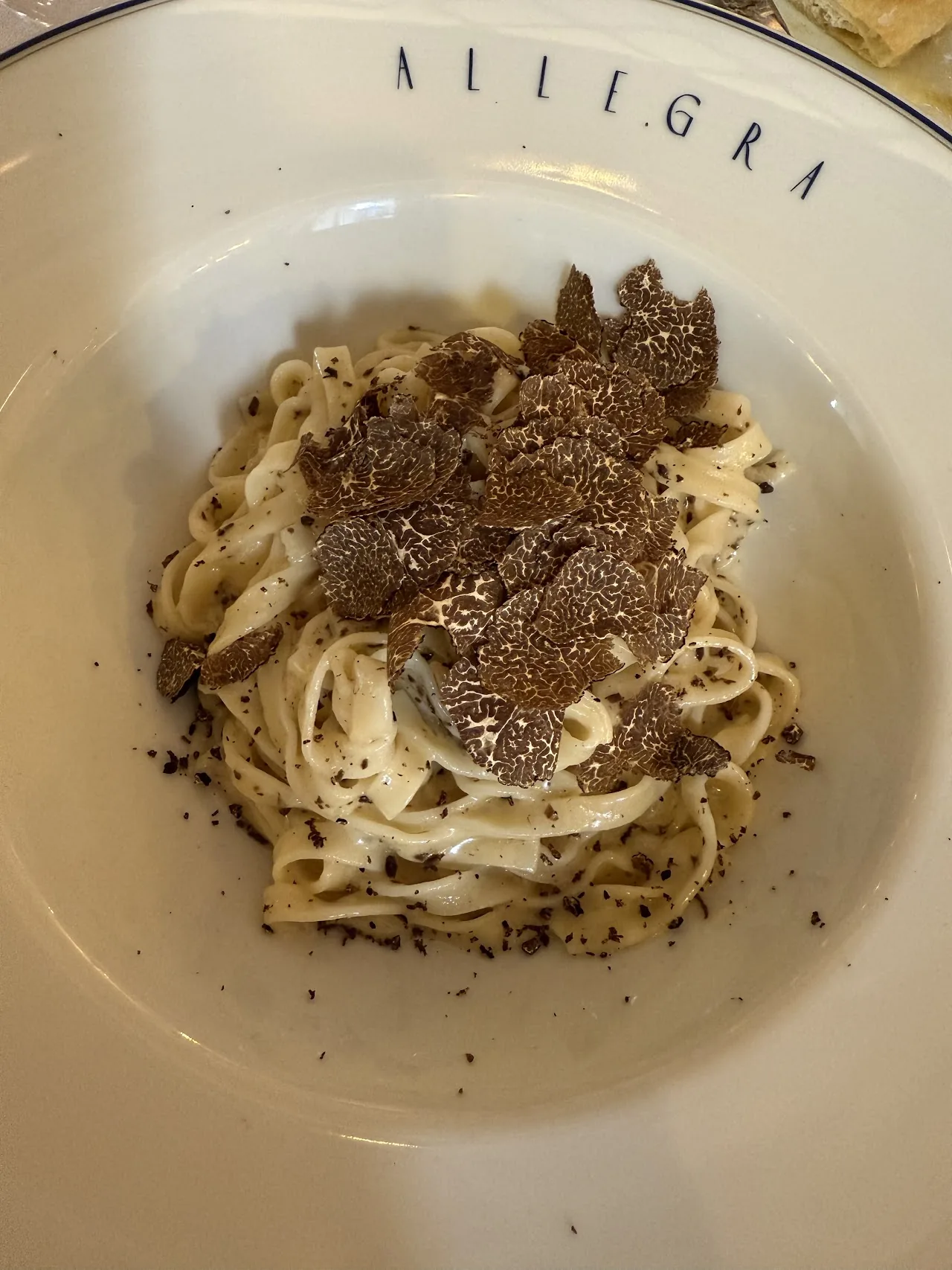 Fettuccine pasta topped with shaved black truffle