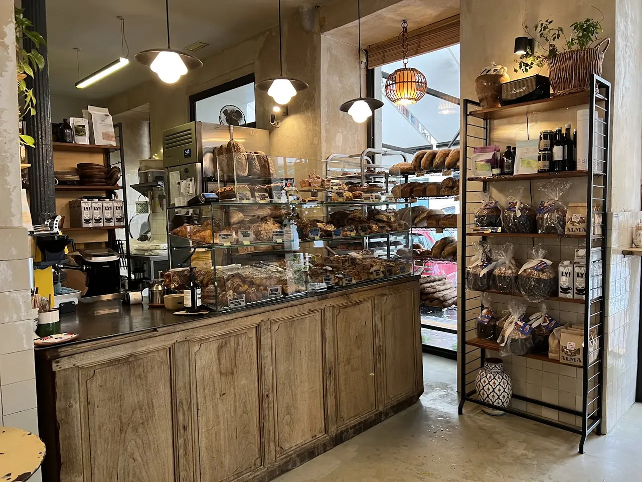 Bakery counter with a glass display case of breads and pastries