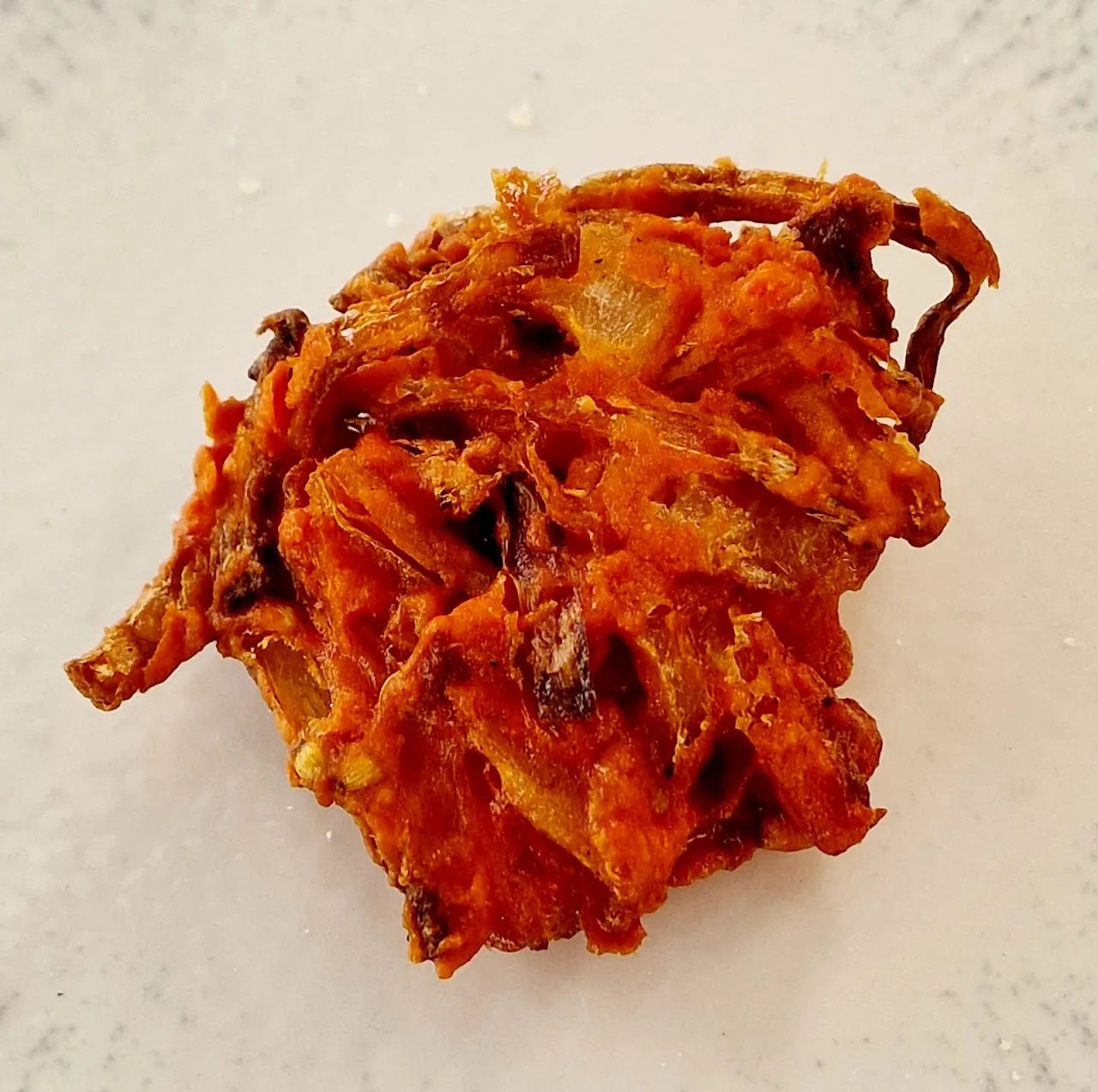 A crispy pile of onion pakora fritters