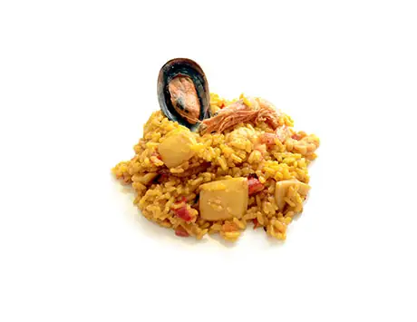 Serving of saffron seafood rice with a mussel, prawn and diced vegetables on a white background