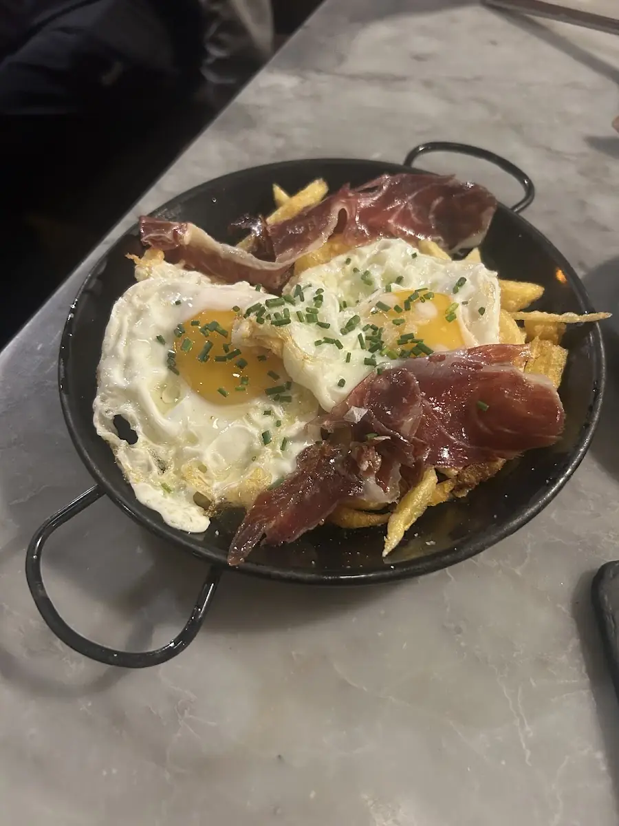 Huevos rotos with jamón at Bar España