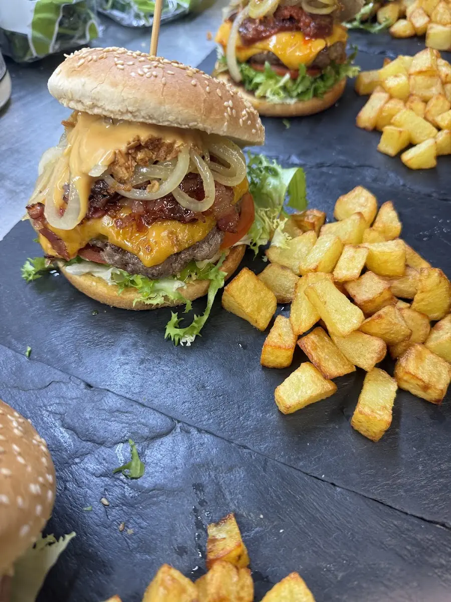 A burger with potatoes at Bar Michel