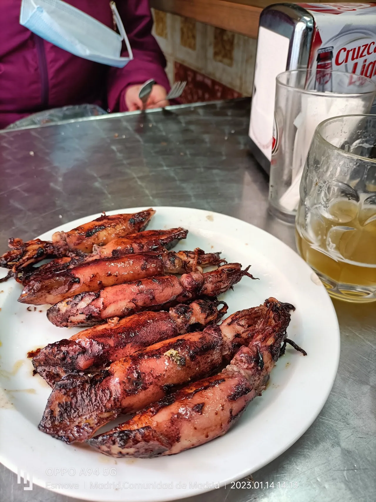 A plate of grilled reddish skewers, likely shellfish