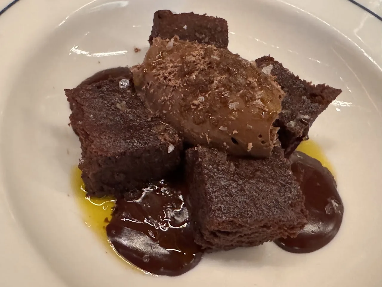 Braised beef chunks in a dark sauce with sesame seeds