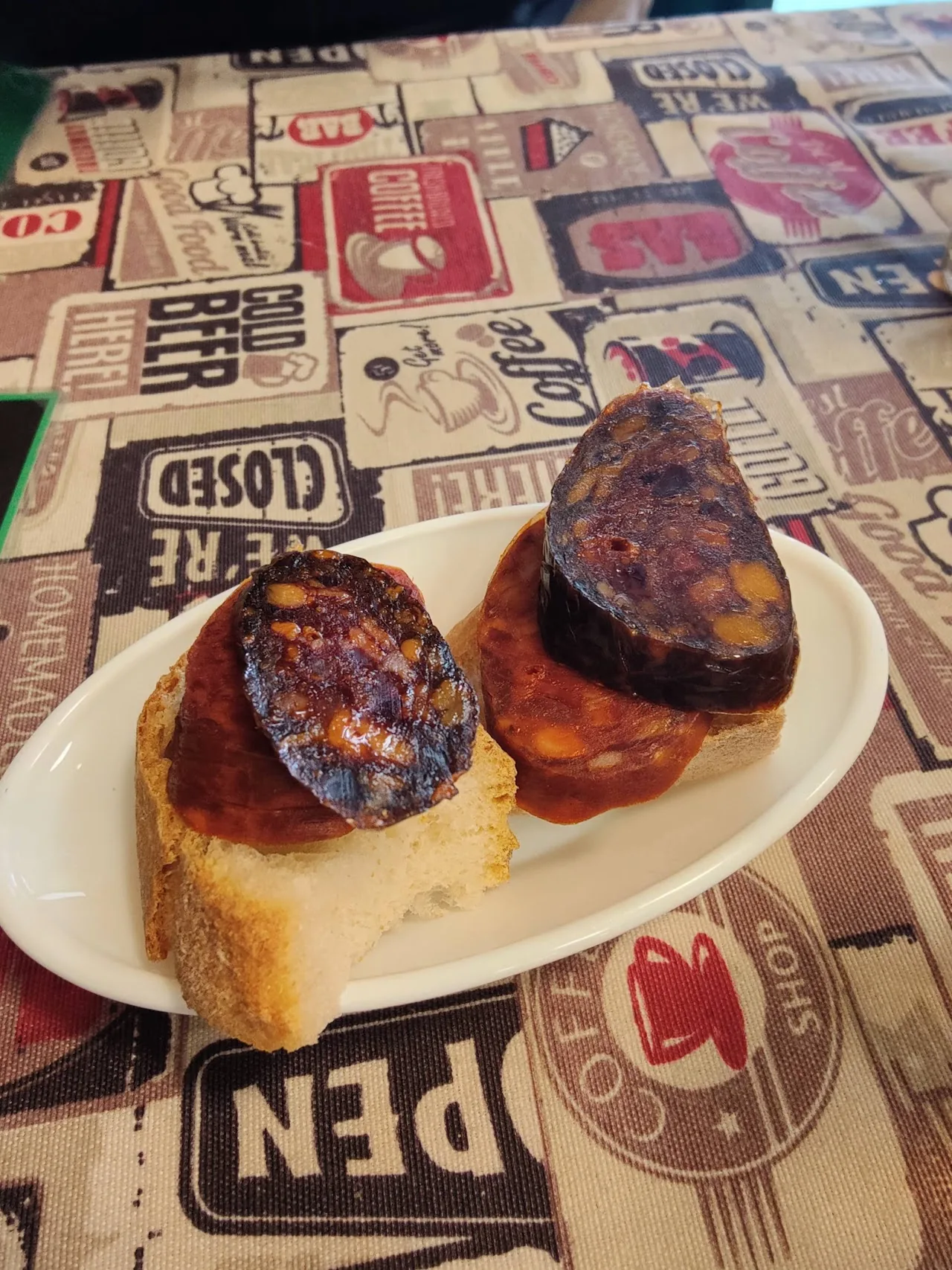 Slices of grilled chorizo served on toasted bread