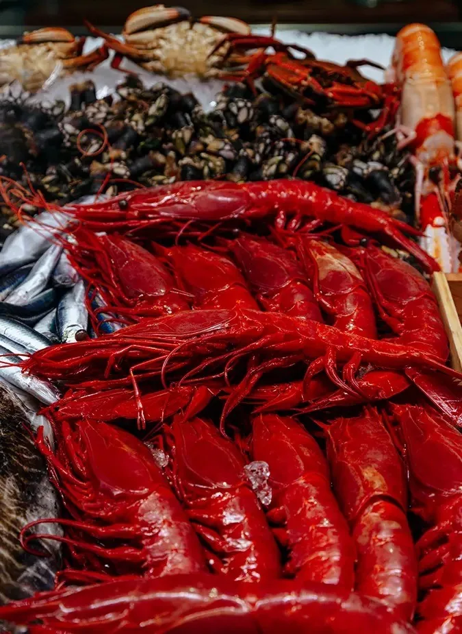 A pile of large red prawns on display