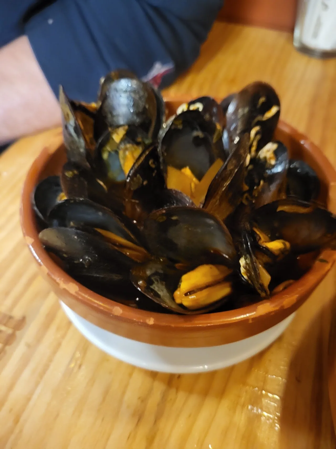 A bowl of steamed mussels in their shells
