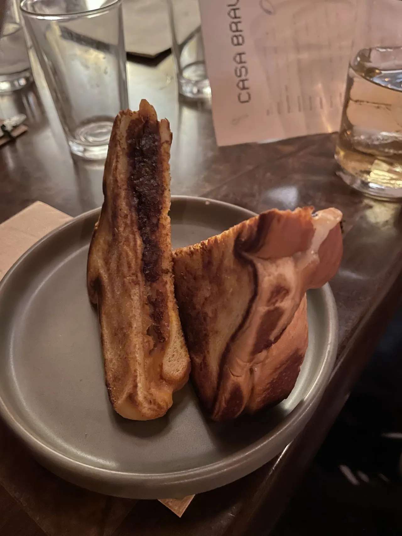 Grilled bread toasts stacked on a plate