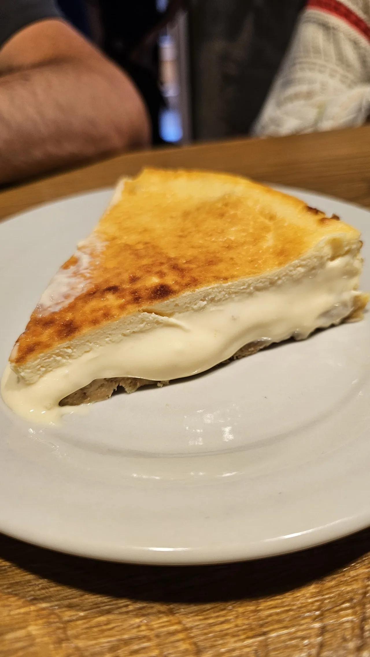 A slice of cheesecake on a white plate