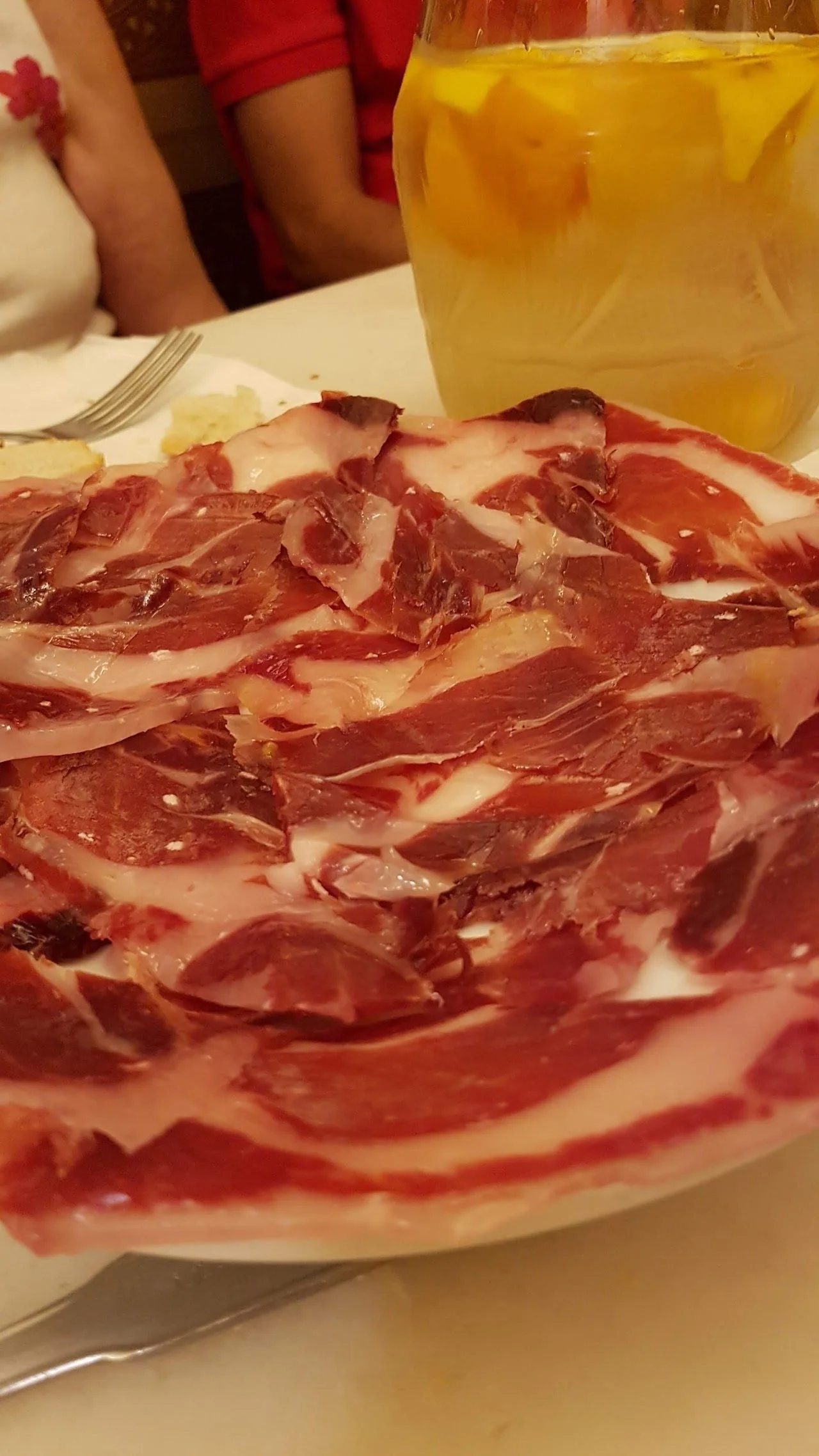 A plate of thinly sliced cured ham