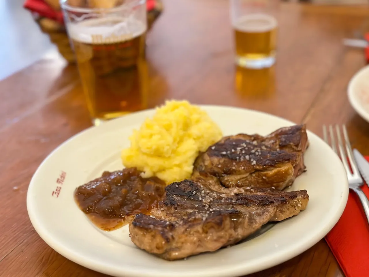 Grilled pork chops served with mashed potato