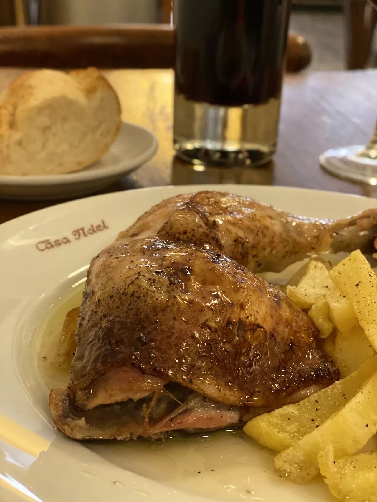 A roasted meat leg served with bread