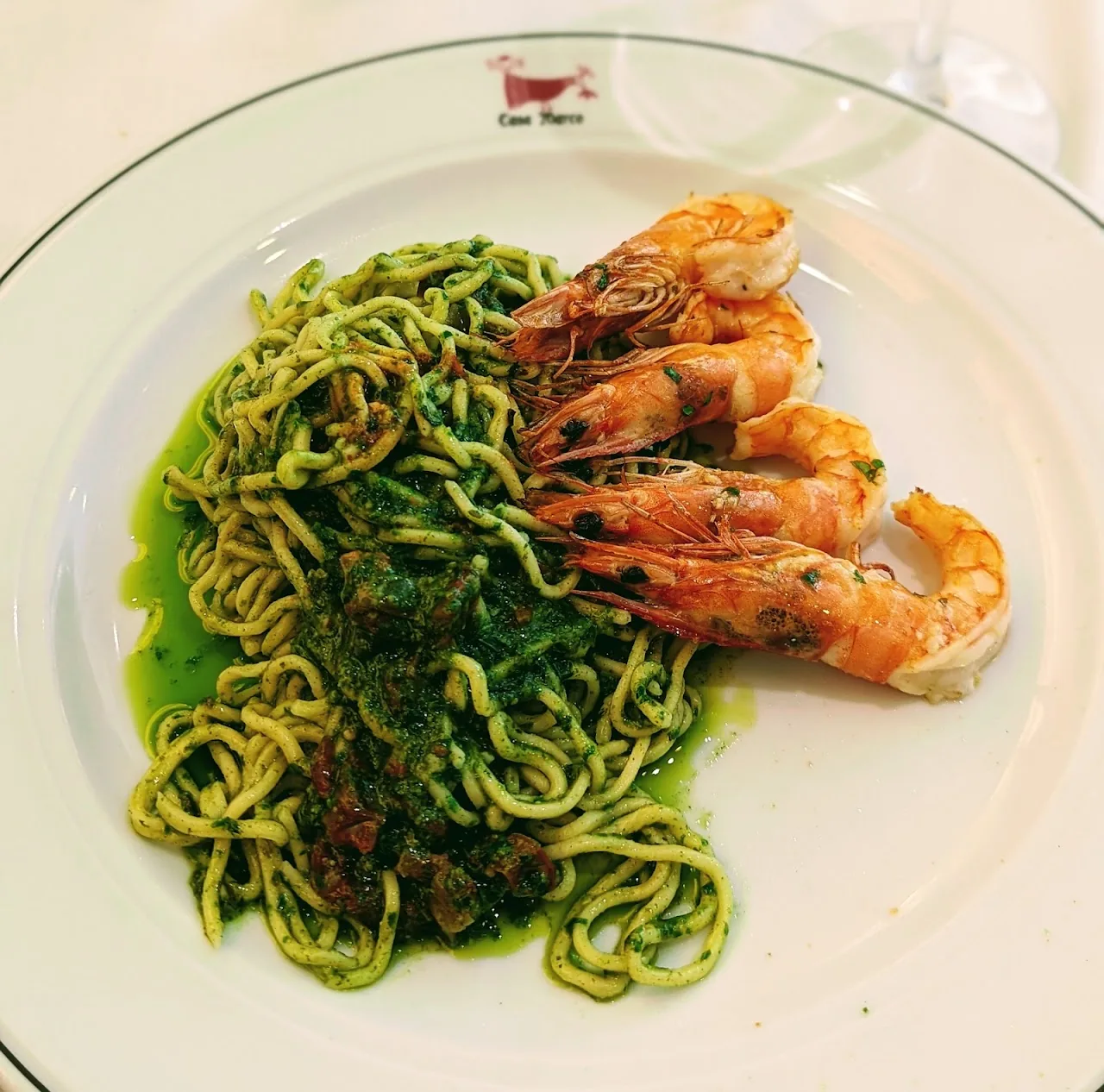Green pasta with zucchini and grilled shrimp