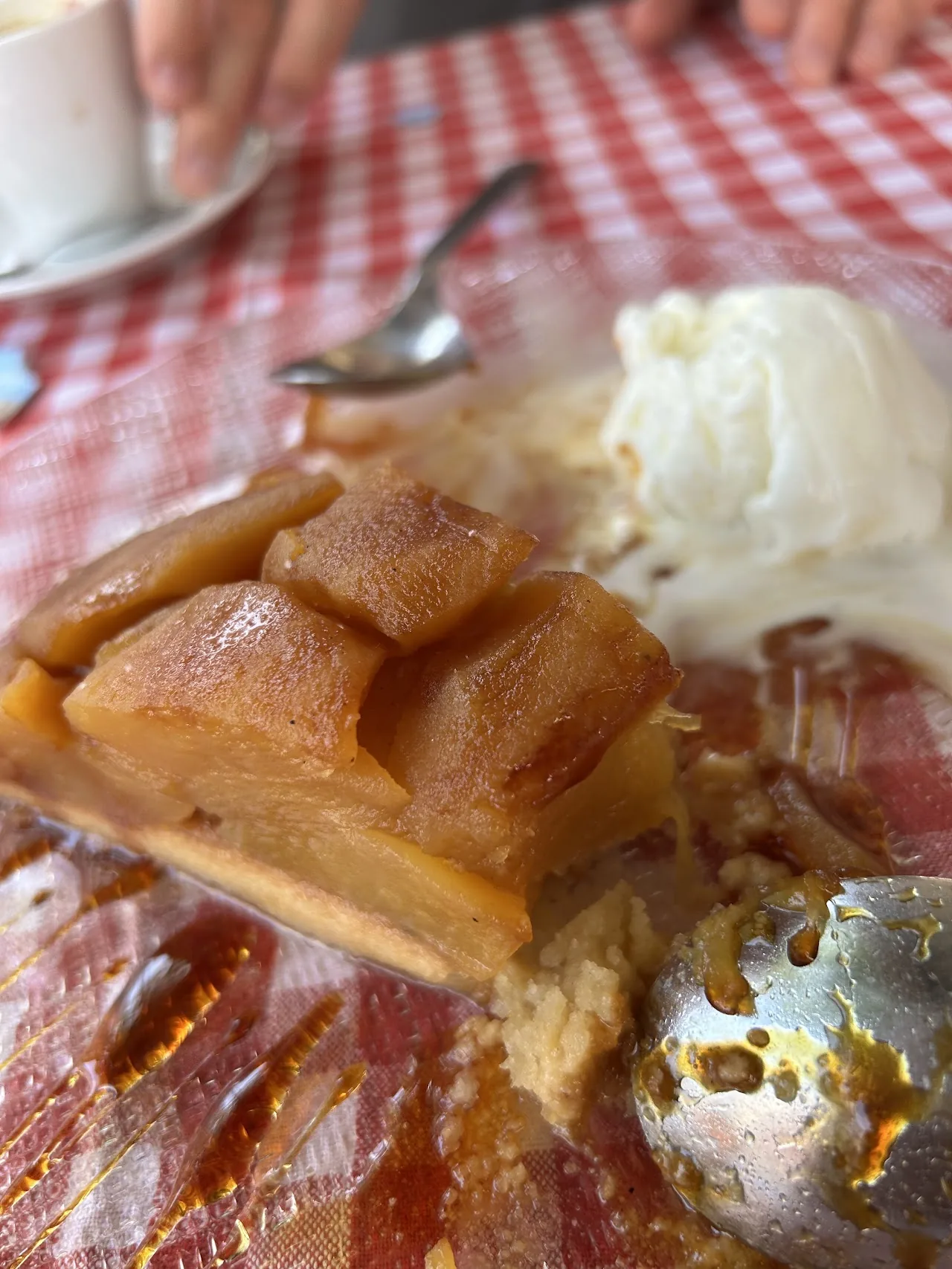 A baked apple dessert with a scoop of vanilla ice cream