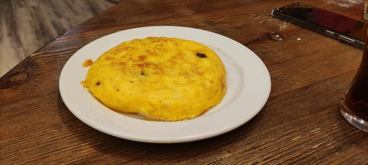 A Spanish tortilla (potato omelet) on a plate