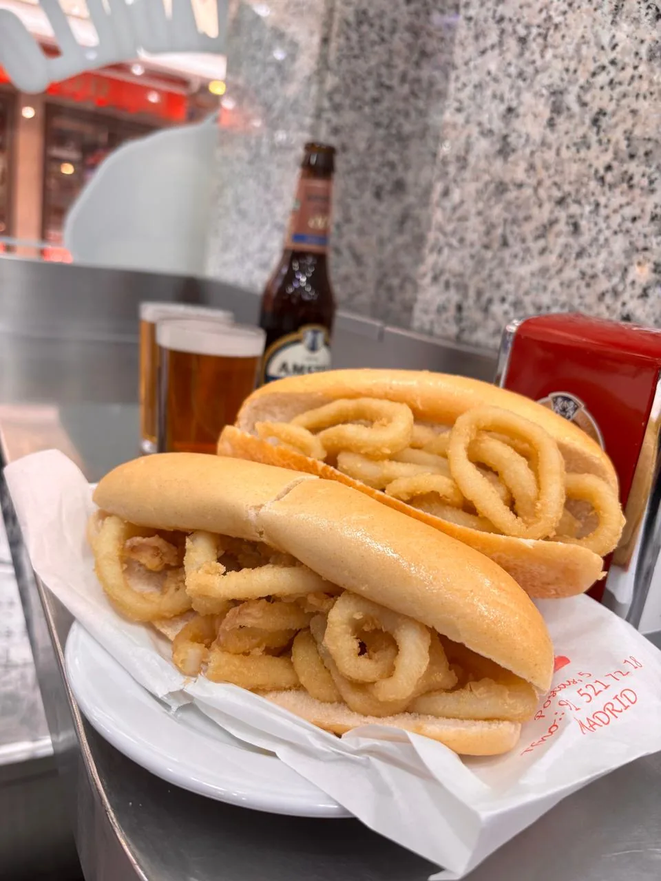 A calamari sandwich (bocadillo de calamares) with the fried rings piled on bread