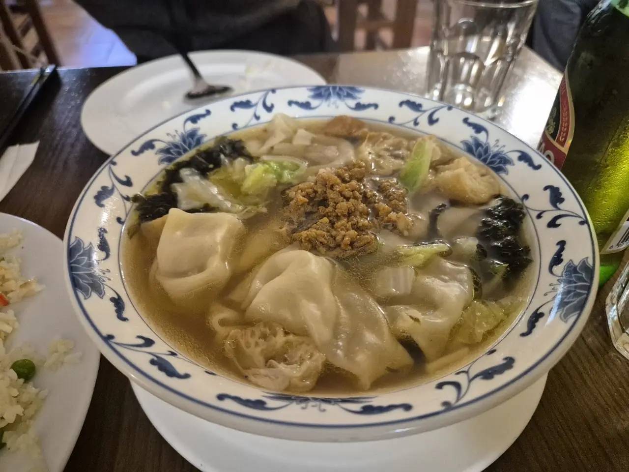 Bowl of wonton soup with dumplings and greens, at Chen Ji.