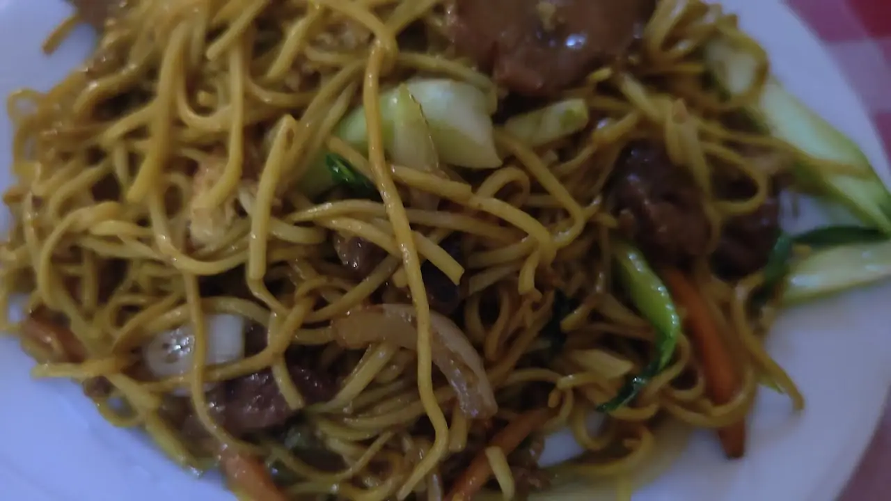 Plate of stir-fried noodles with beef and pak choi, at Chen Ji.