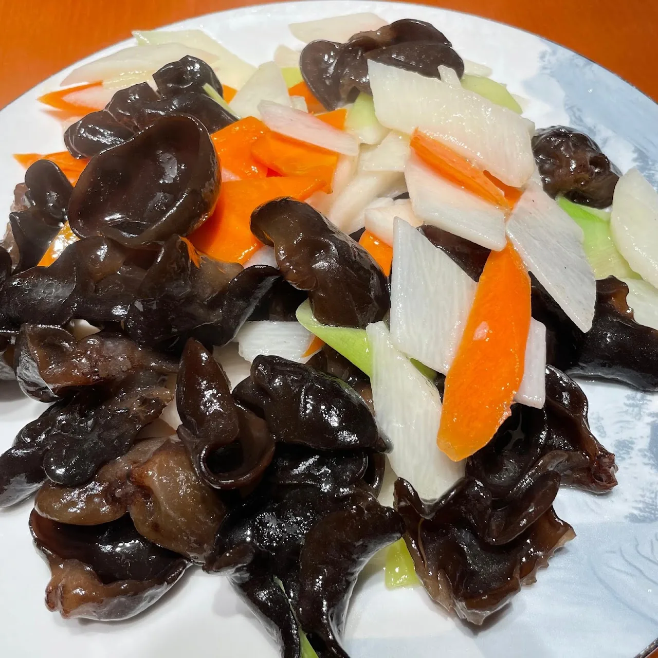 A cold salad of wood ear mushrooms with carrot and cucumber