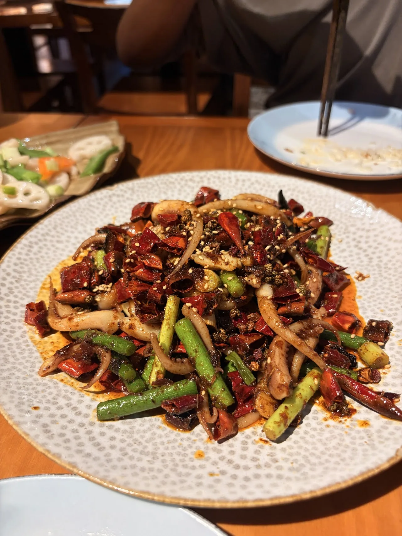 A stir-fry of beef and green peppers in a dark sauce