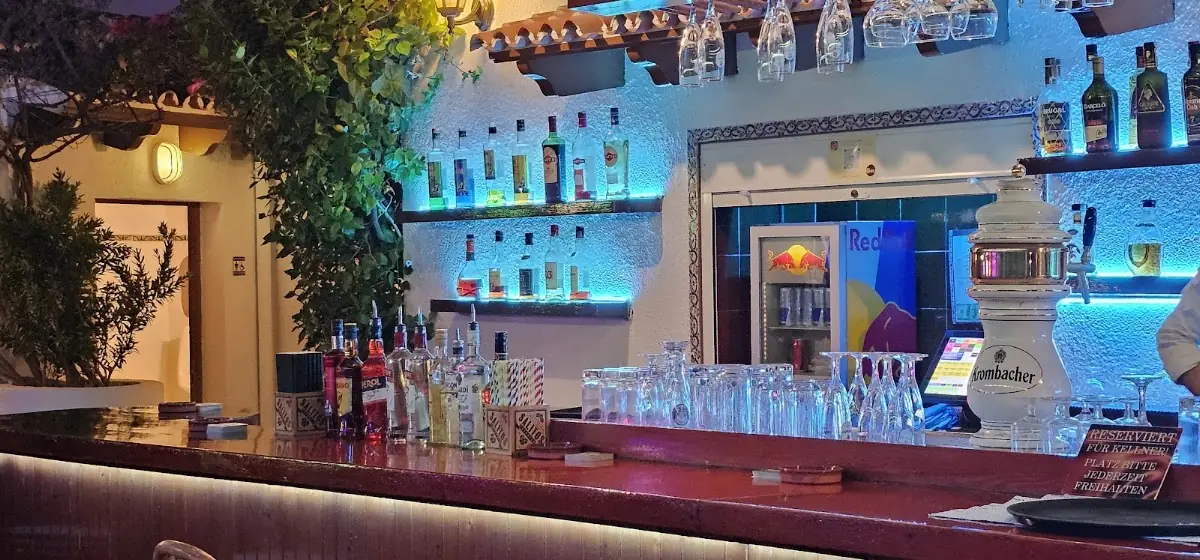 The neon-lit bar at Chocolate Music-Bar in Cala Ratjada