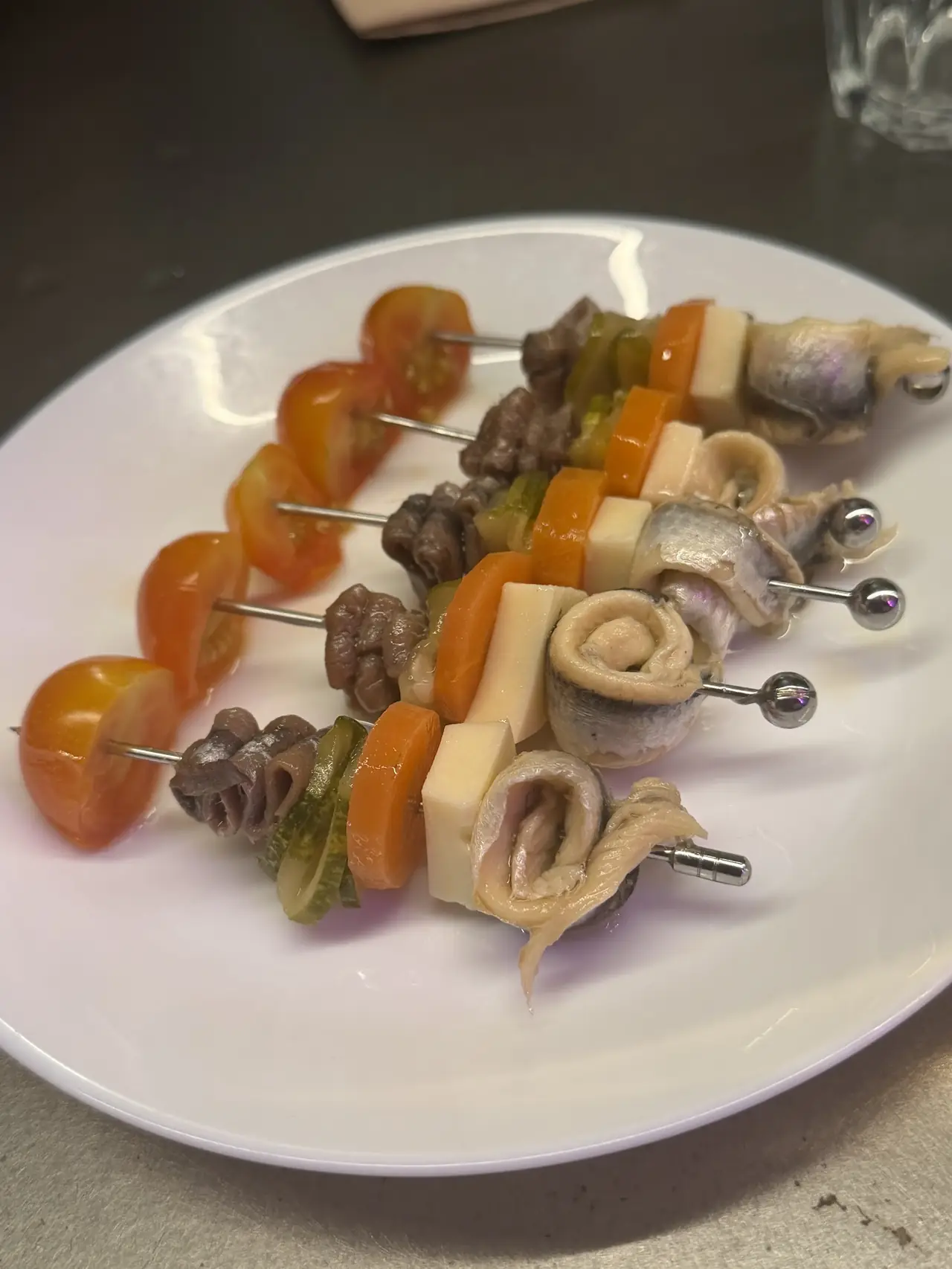 Gilda-style skewers with anchovy, cheese, carrot, gherkin and tomato