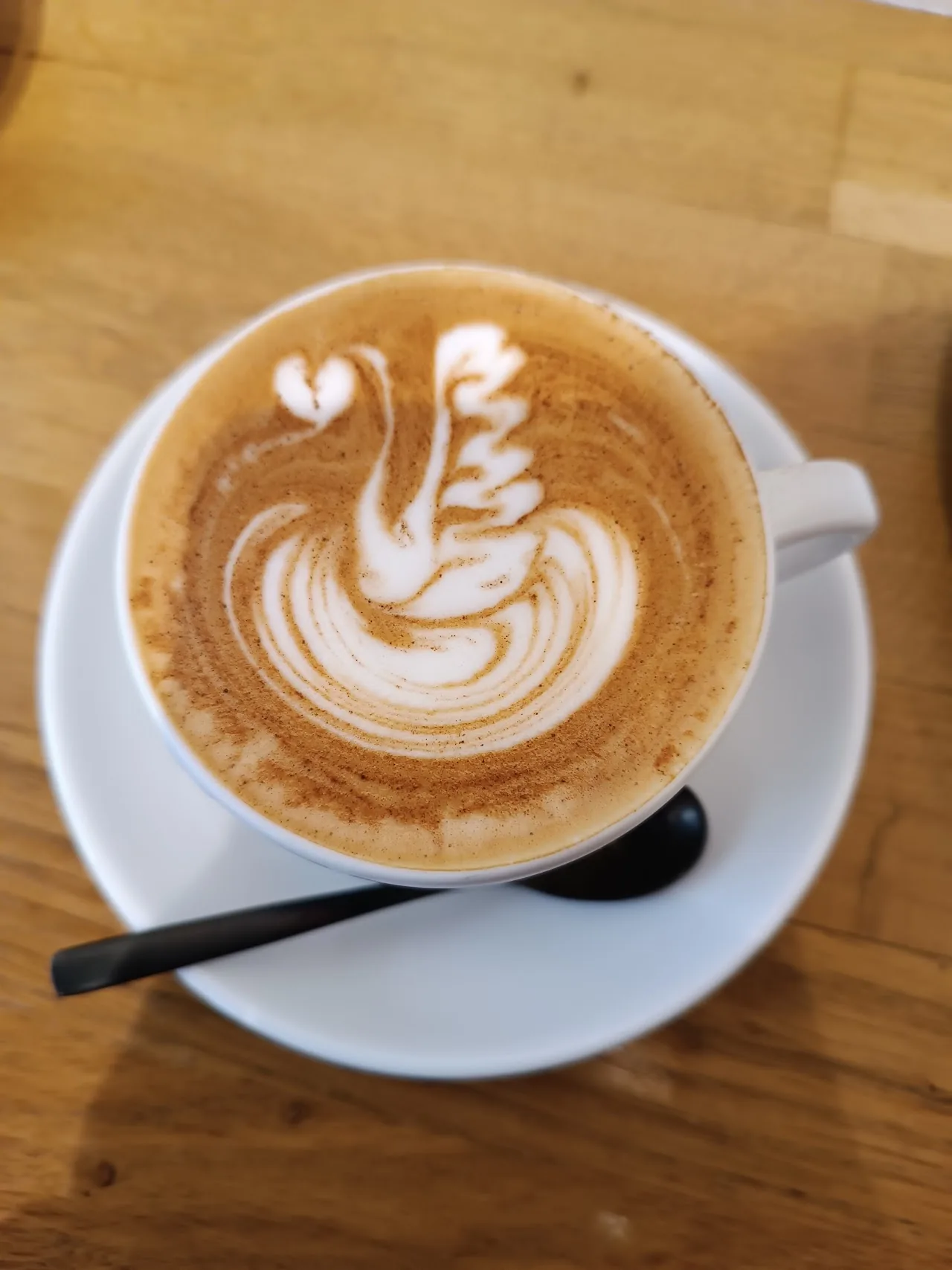 A cappuccino with swan-shaped latte art
