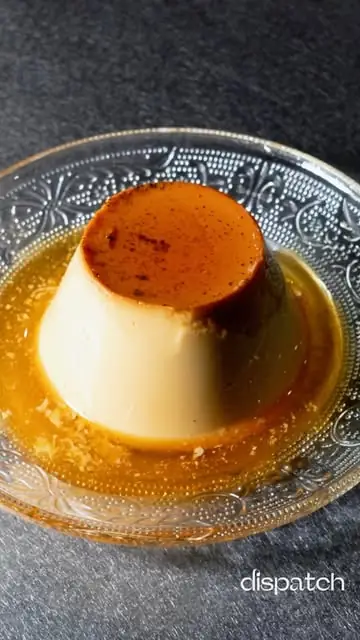 A flan (crème caramel) in caramel sauce in a pressed-glass dish, with a small dispatch corner logo