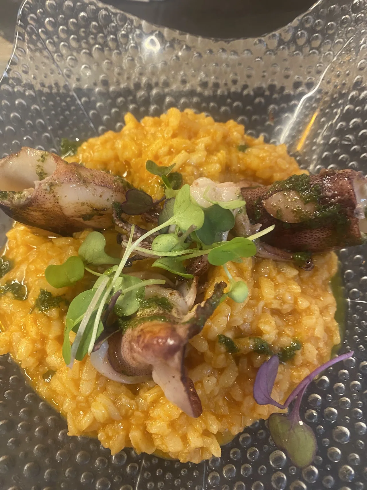 A saffron risotto with mushrooms and asparagus tips
