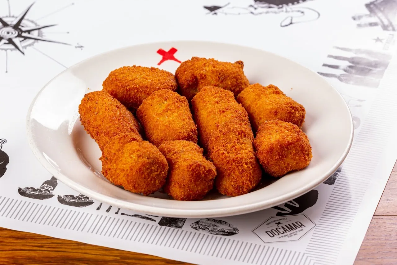 A plate of breaded croquettes