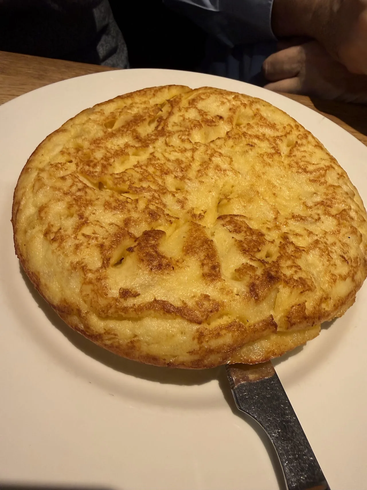 A Spanish tortilla in a frying pan