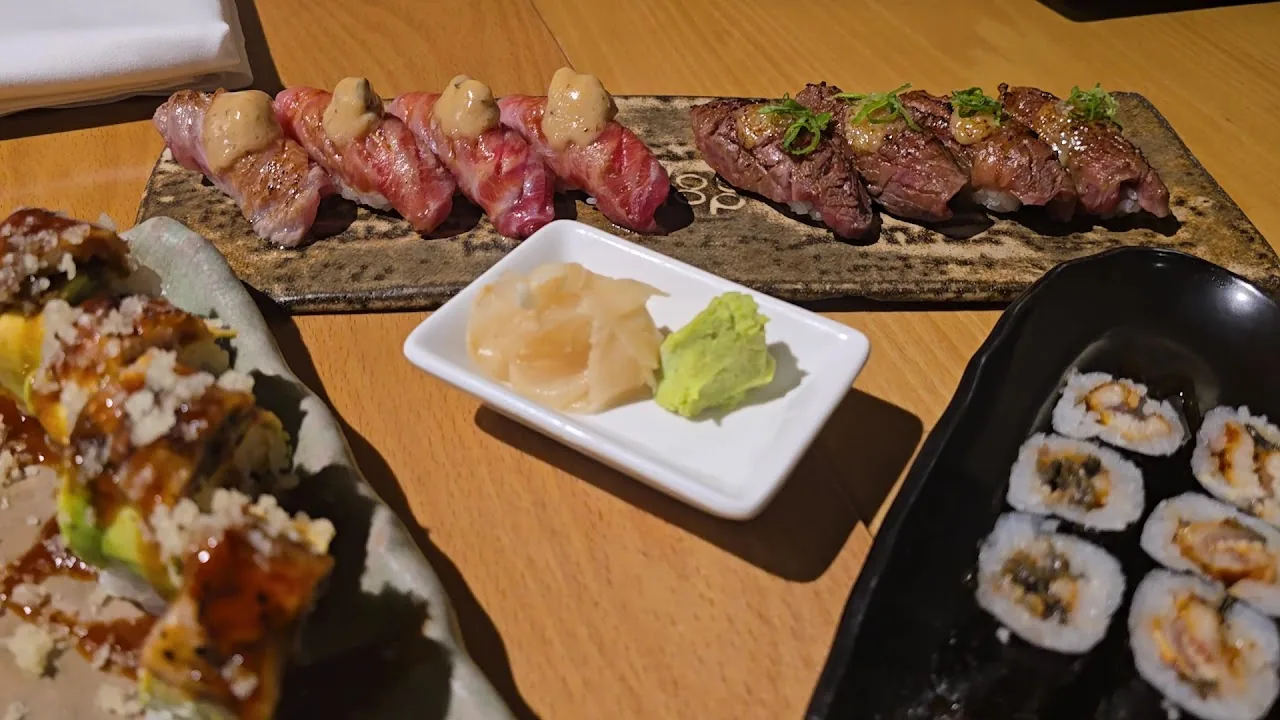 A platter of wagyu nigiri and sushi rolls