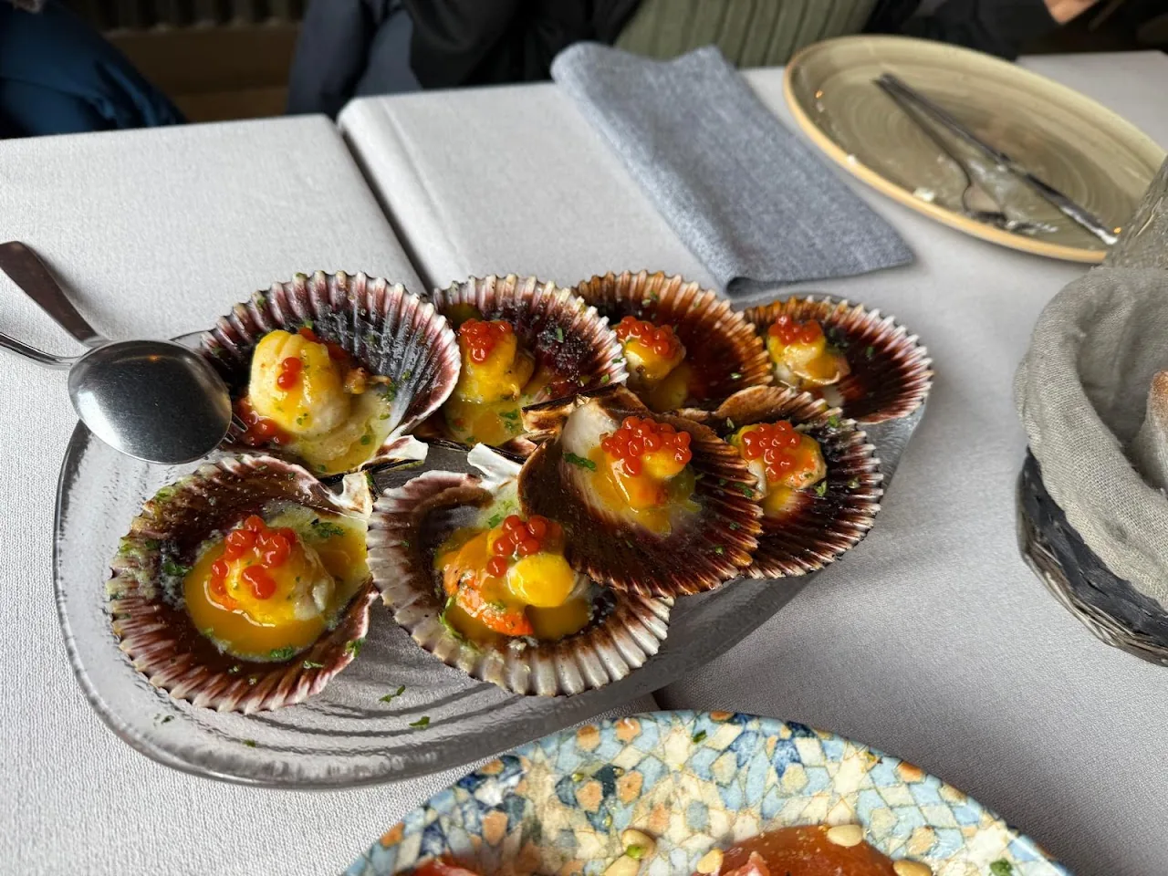Scallops on the half shell topped with a golden gratin