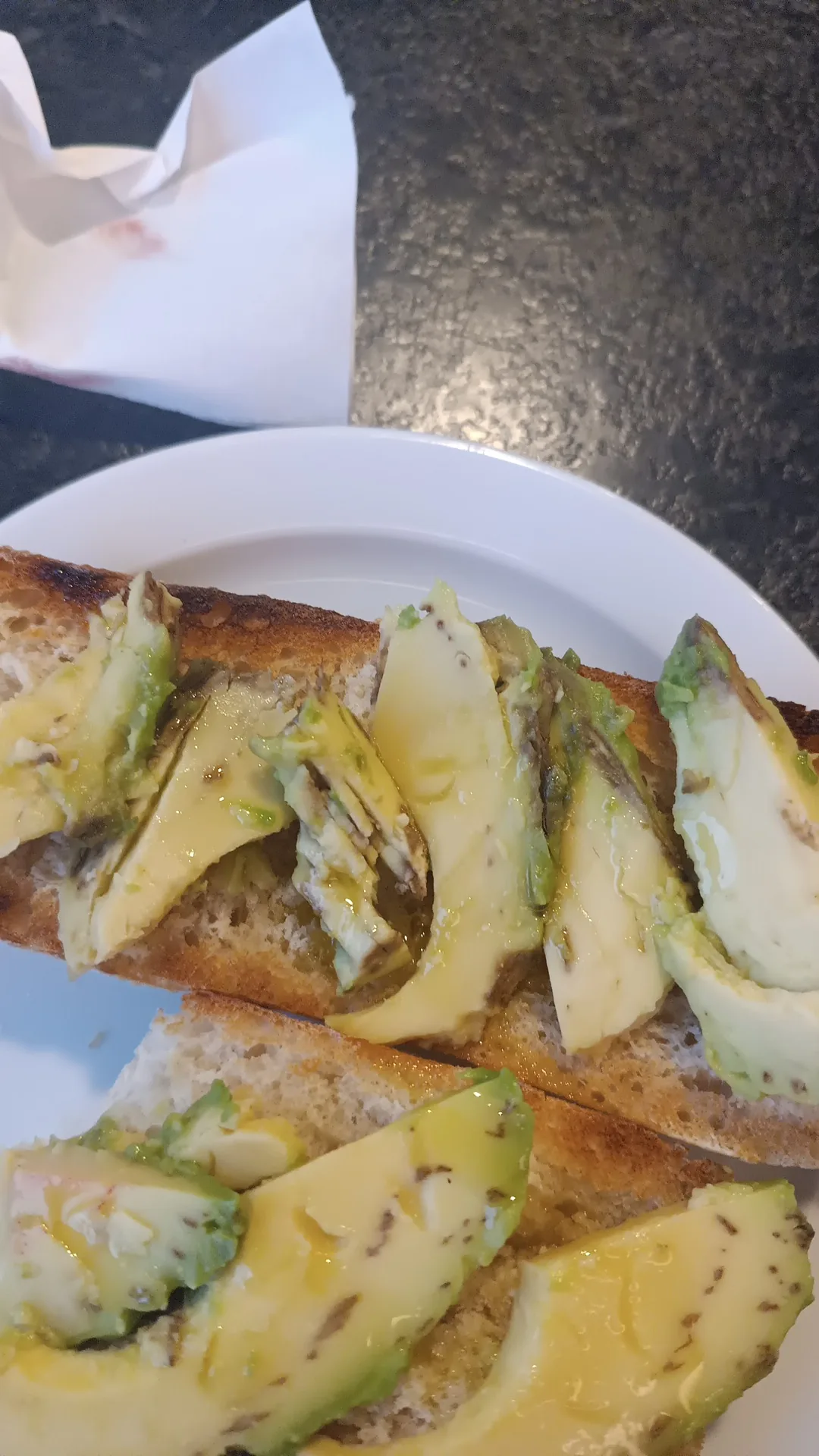 Toasted bread slices topped with mashed avocado
