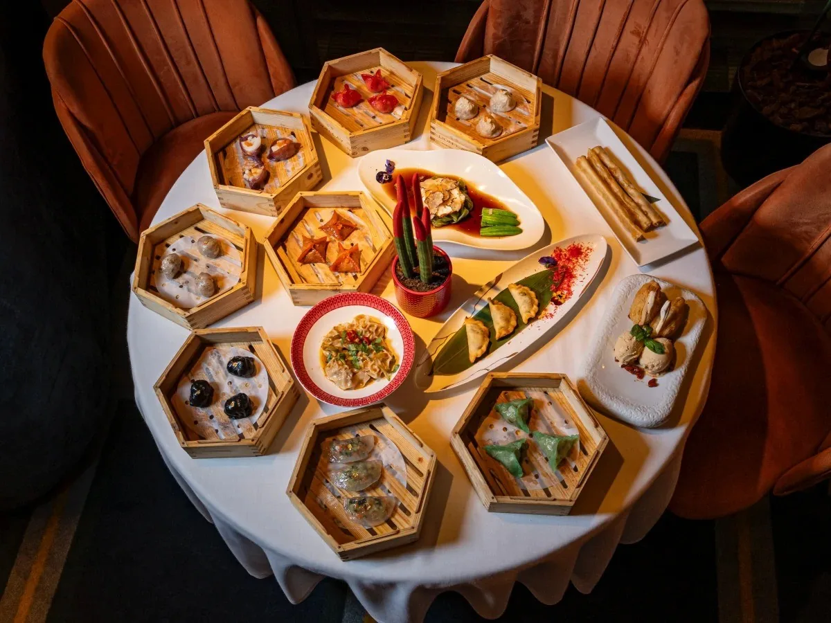 A round platter of hexagonal steamer baskets of dim sum