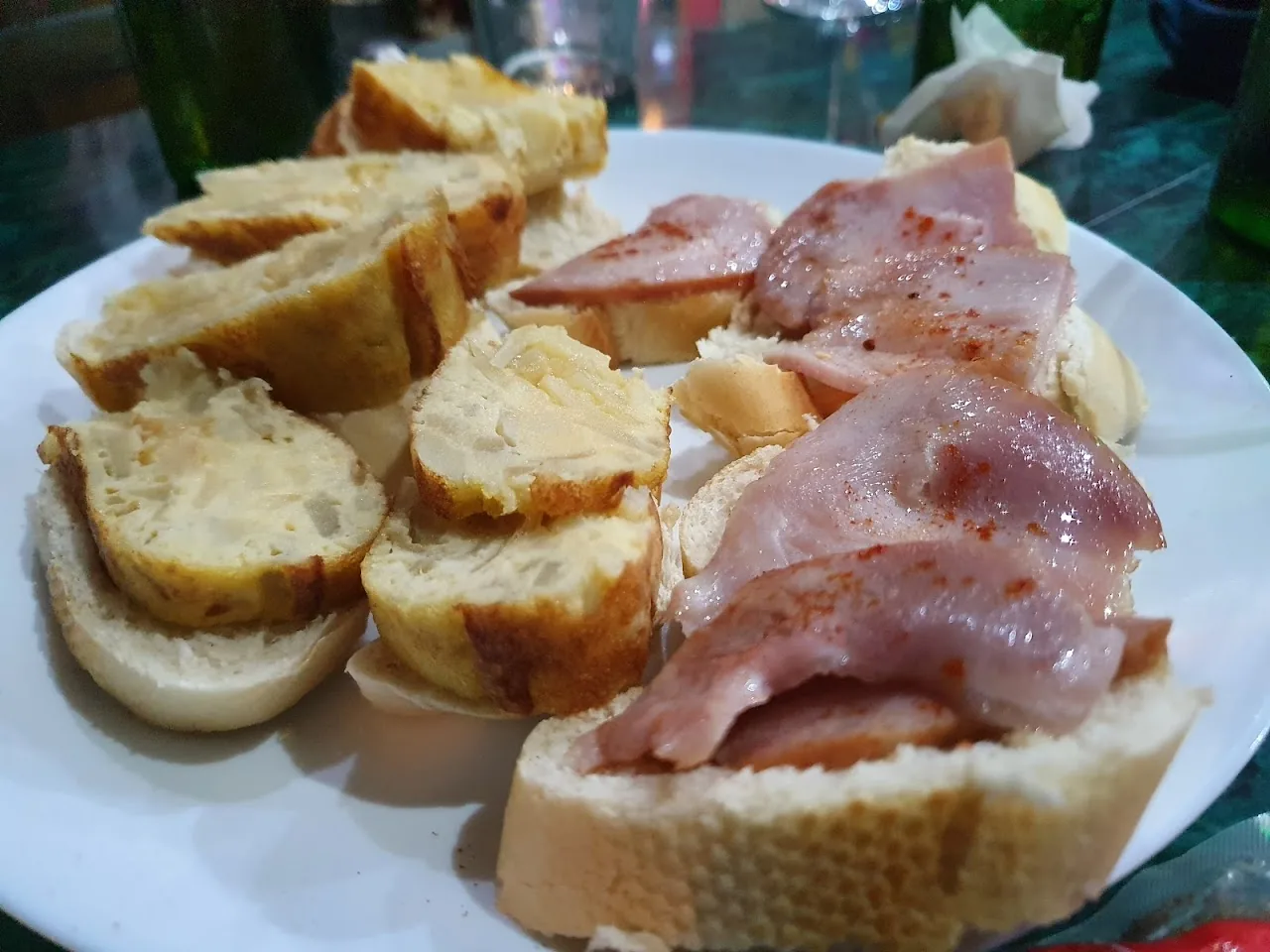 Slices of baguette topped with cured ham