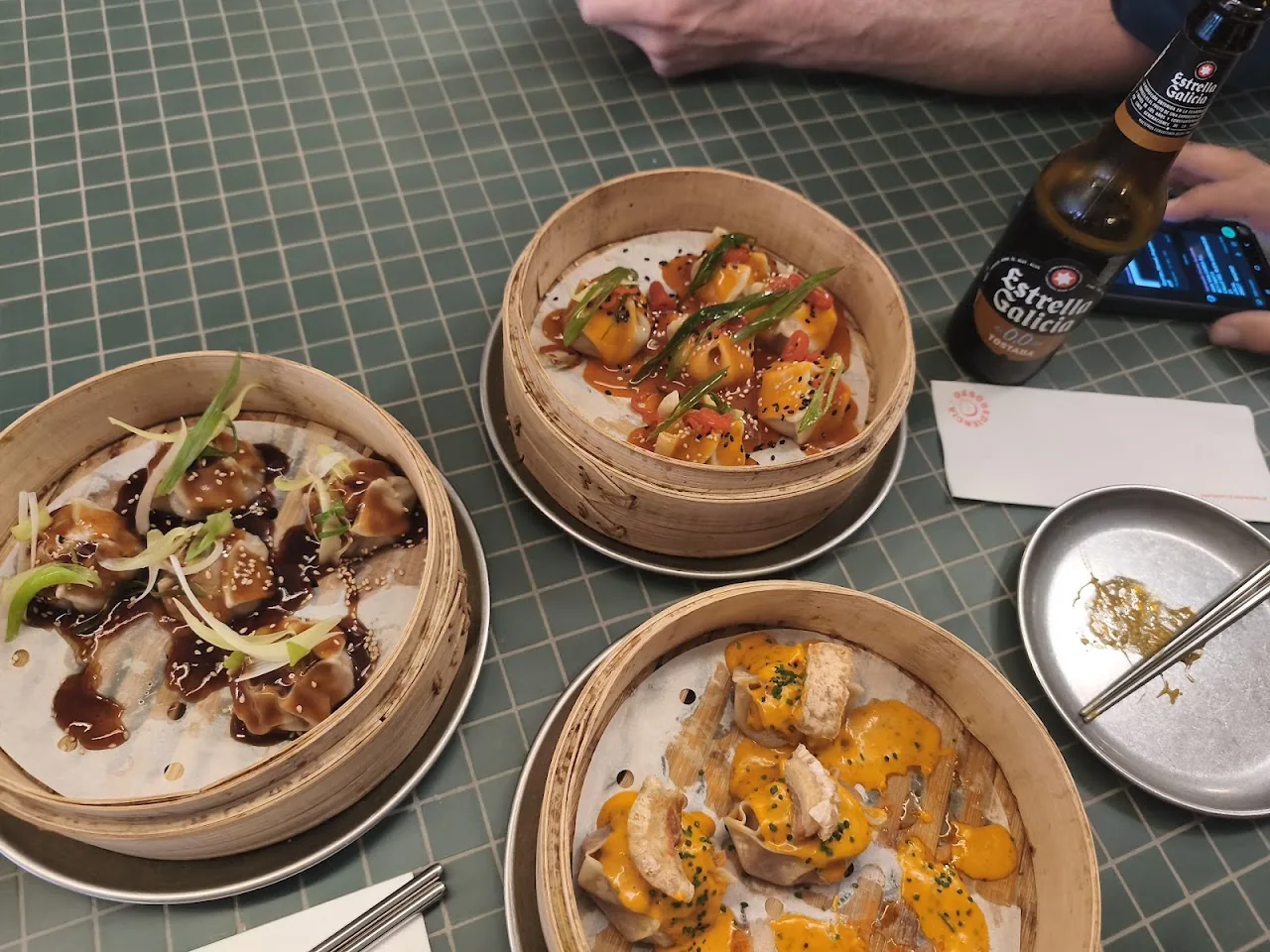 Three bamboo steamers of assorted dumplings