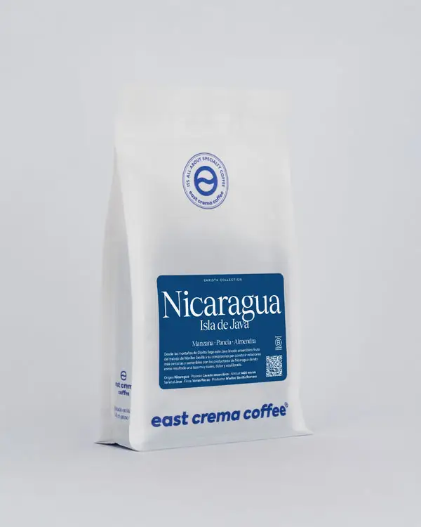 White retail coffee bag branded east crema coffee with a blue Nicaragua Isla de Java label