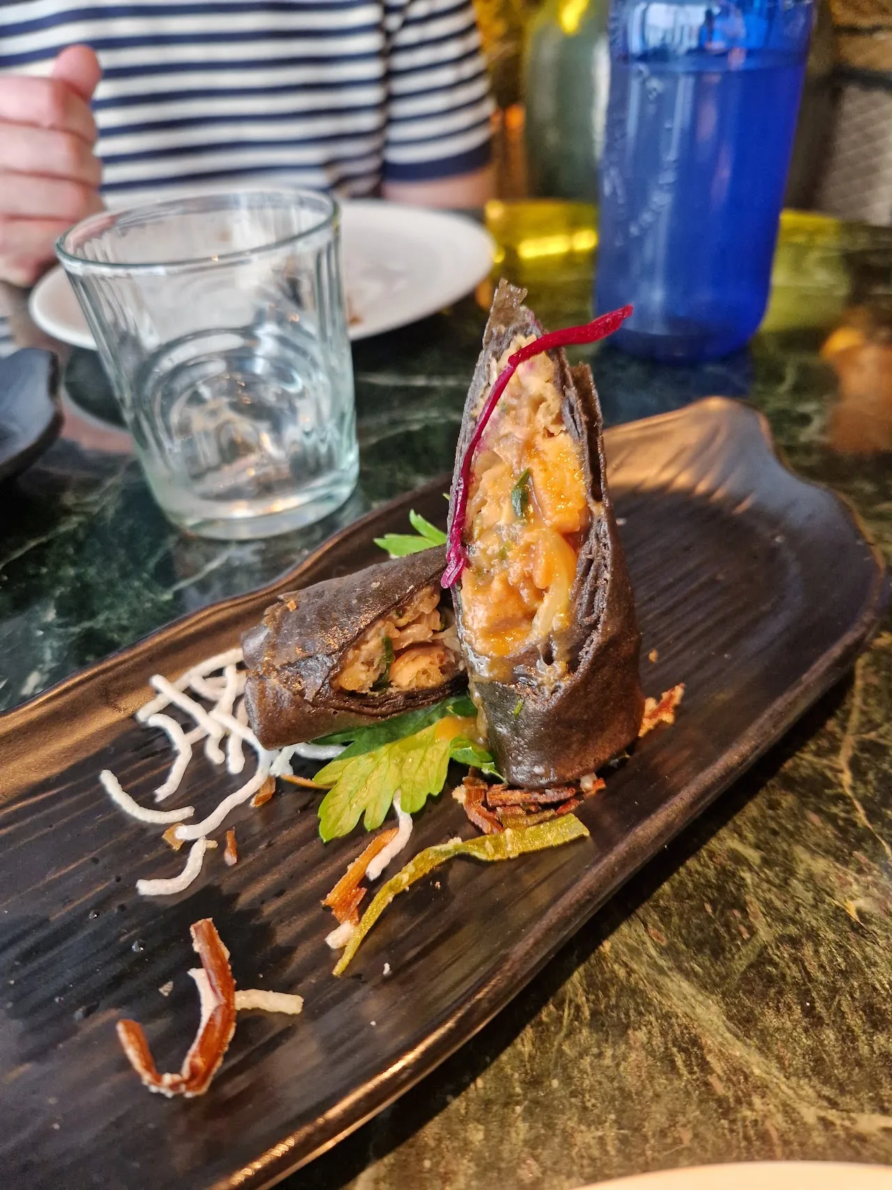 A seafood dish served on a wooden board