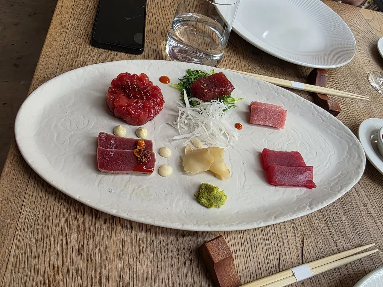 Bluefin tuna tasting plate with tartare, sashimi cuts, wakame, wasabi and pickled ginger