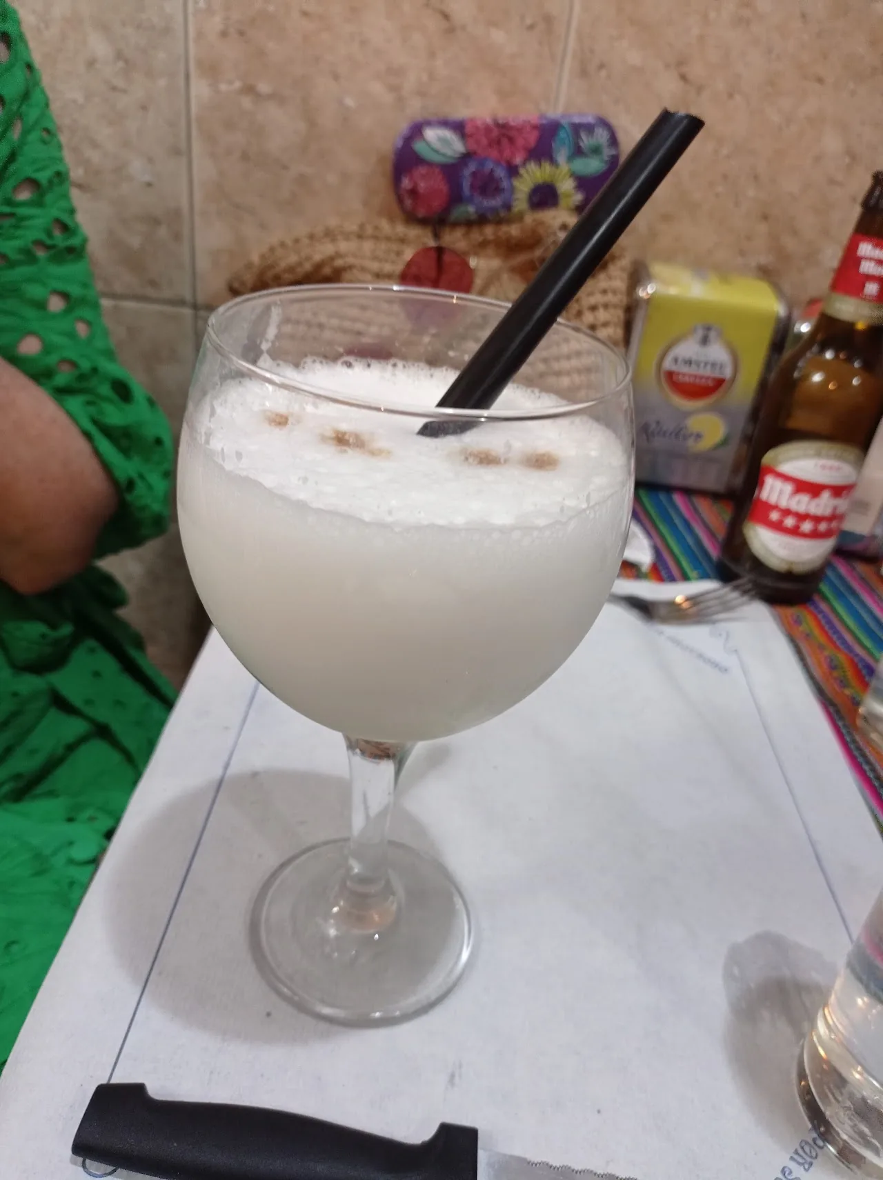 A pisco sour cocktail with foam