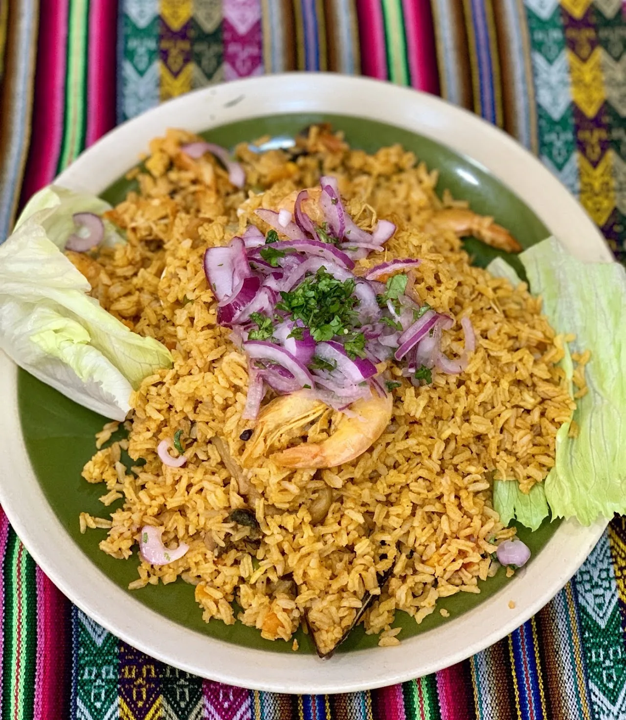 A rice dish with seafood and mussels