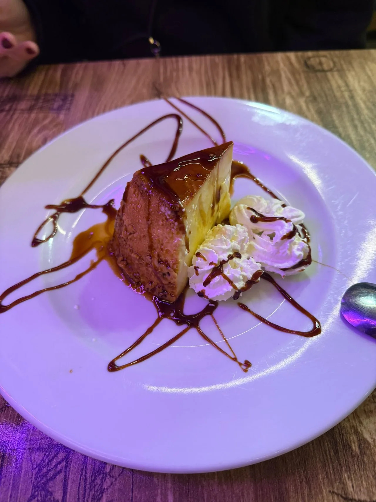 A dessert plate with a drizzled sauce