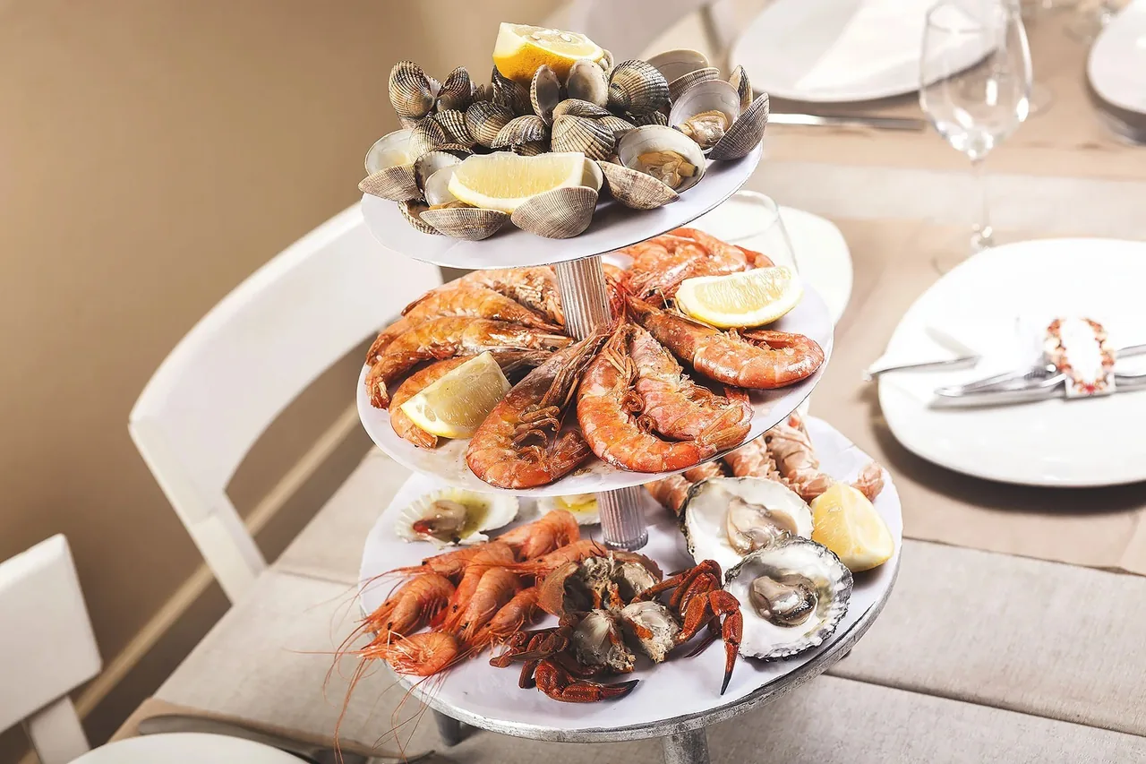 A tiered stand of shellfish and prawns