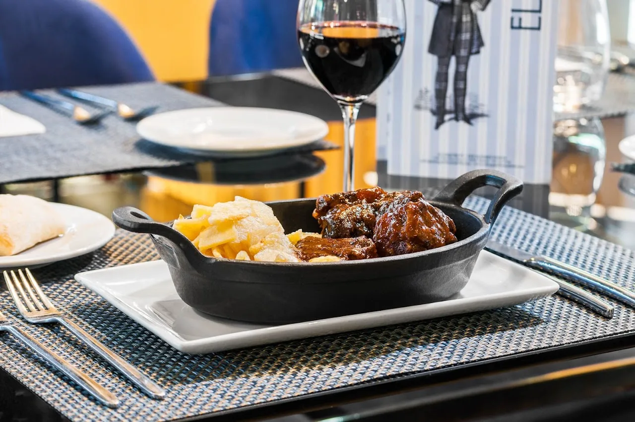 A meat stew served in a small cast-iron pot